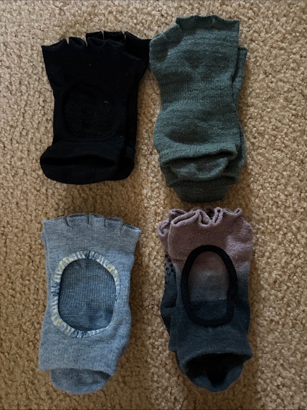 Four pairs of Toesox in Black, Green, Gray, Heather Blue